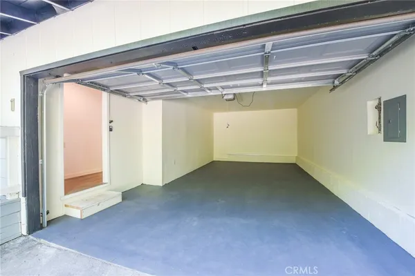 a view of an empty room and wooden floor
