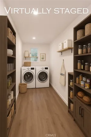 a kitchen with granite countertop a sink a counter space appliances and cabinets