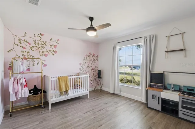 a bedroom with furniture and a window