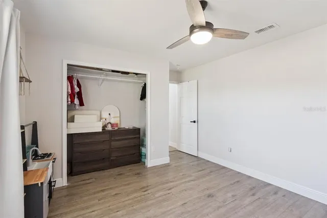 a room that has a dresser and a mirror