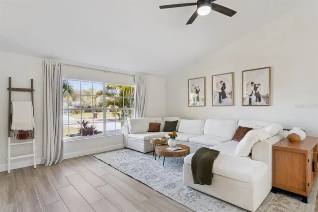 a living room with furniture and a large window