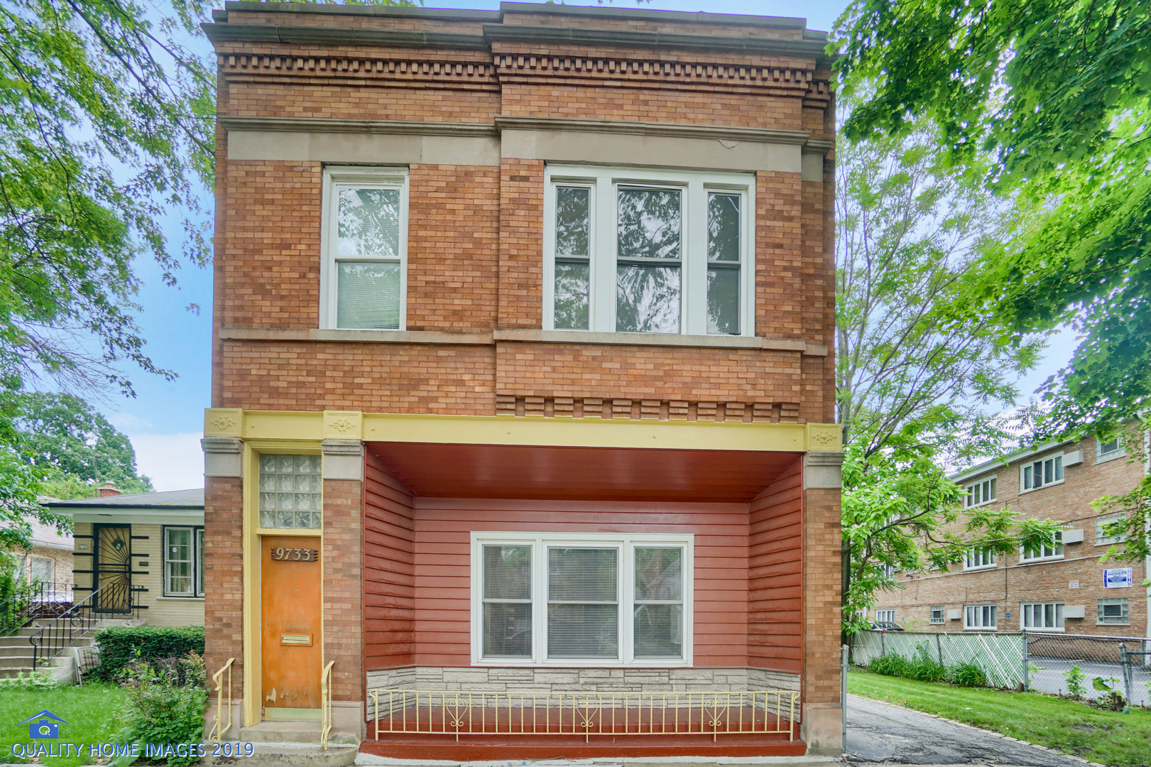 front view of a brick house with a window