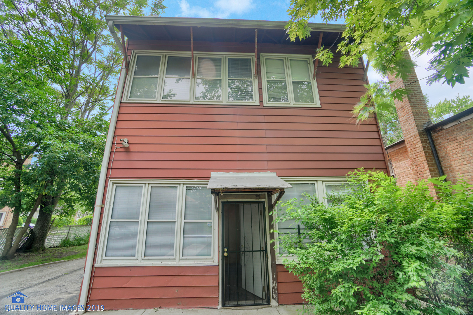 9733 South Charles Street Chicago, IL 60643 - Photo 25 of 26 a front view of a house with a yard