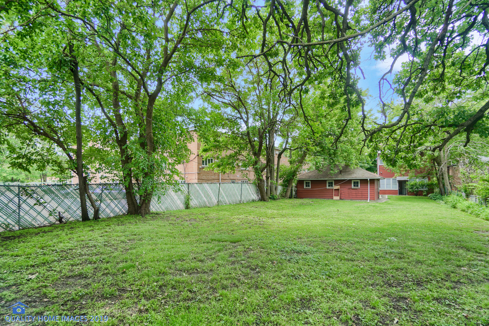 9733 South Charles Street Chicago, IL 60643 - Photo 26 of 26 a view of a yard with a house in the background