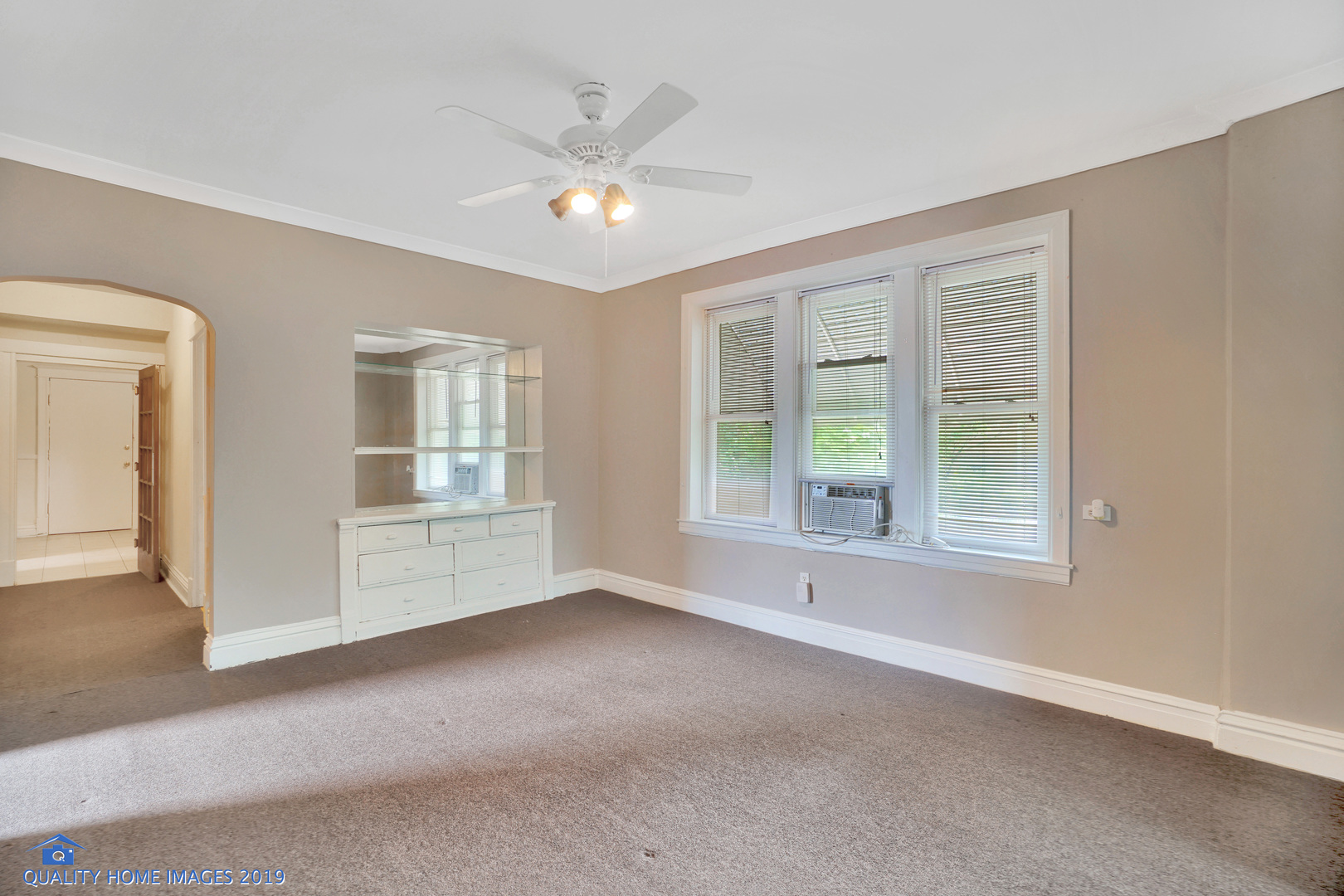 9733 South Charles Street Chicago, IL 60643 - Photo 5 of 26 an empty room with windows and chandelier fan