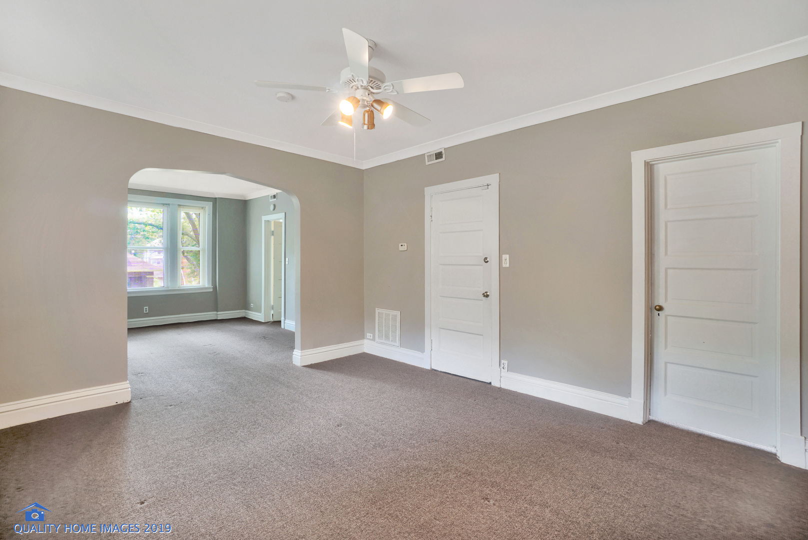 9733 South Charles Street Chicago, IL 60643 - Photo 6 of 26 a view of an empty room with a chandelier fan