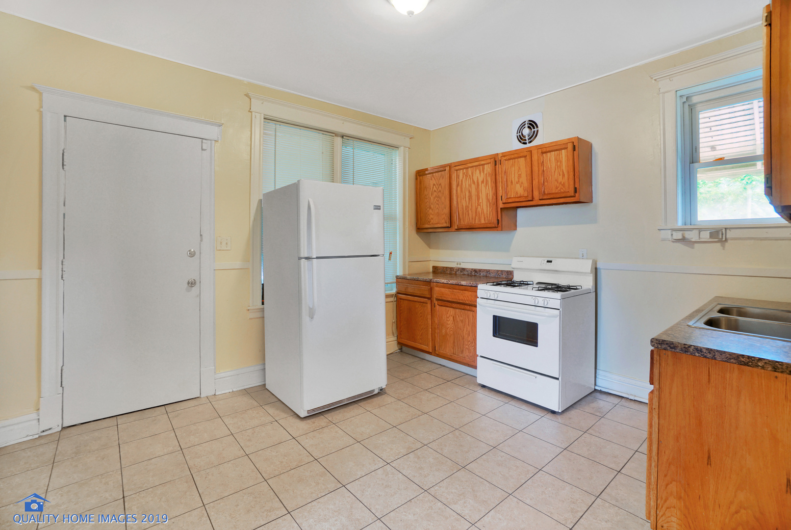 9733 South Charles Street Chicago, IL 60643 - Photo 7 of 26 a kitchen with white cabinets and white appliances