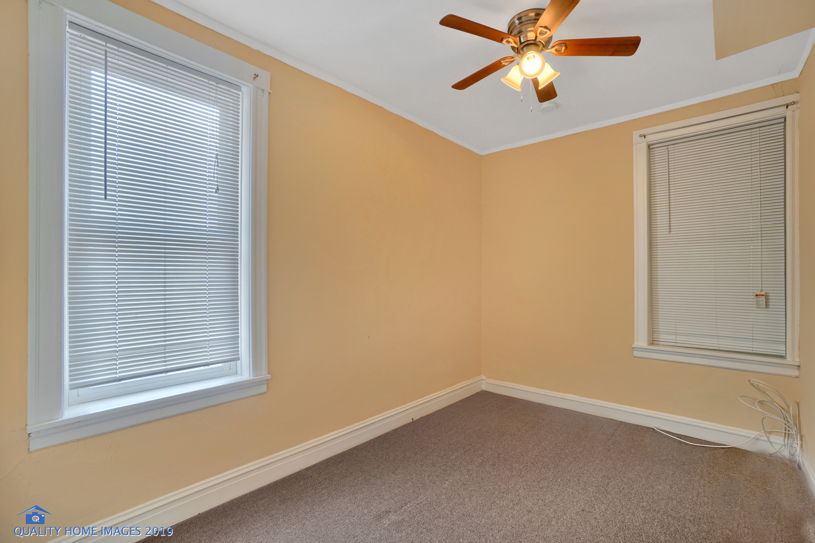 9733 South Charles Street Chicago, IL 60643 - Photo 10 of 26 an empty room with windows and fan