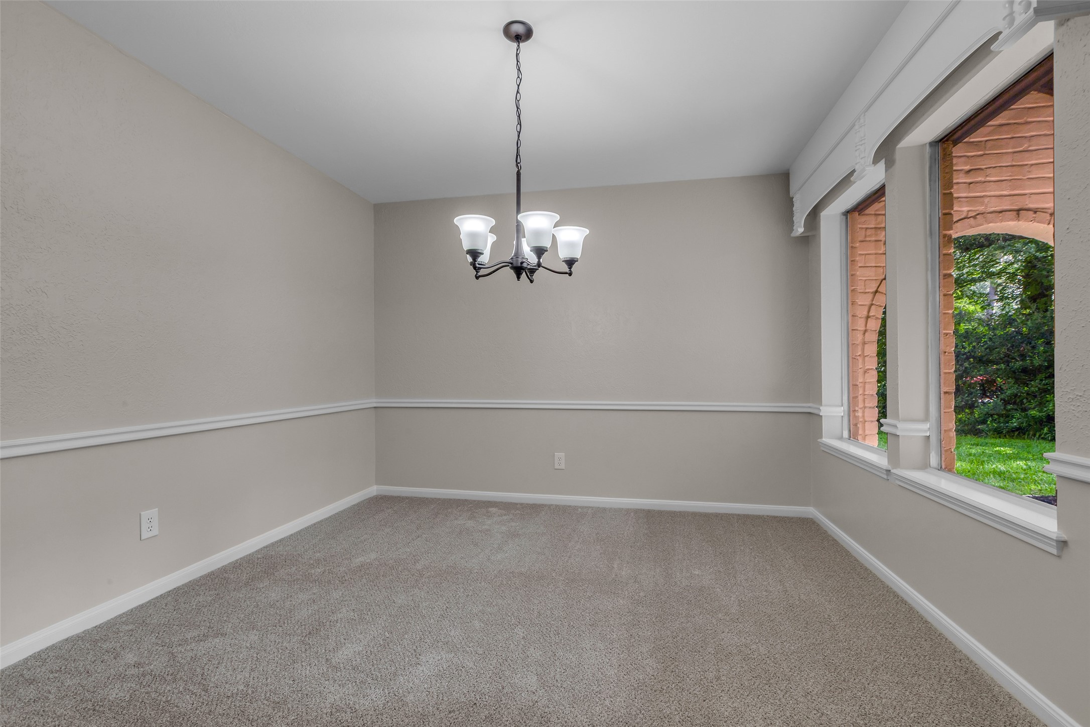 6415 Bayonne Drive Spring, TX 77389 - Photo 11 of 40 a view of a room with windows and chandelier