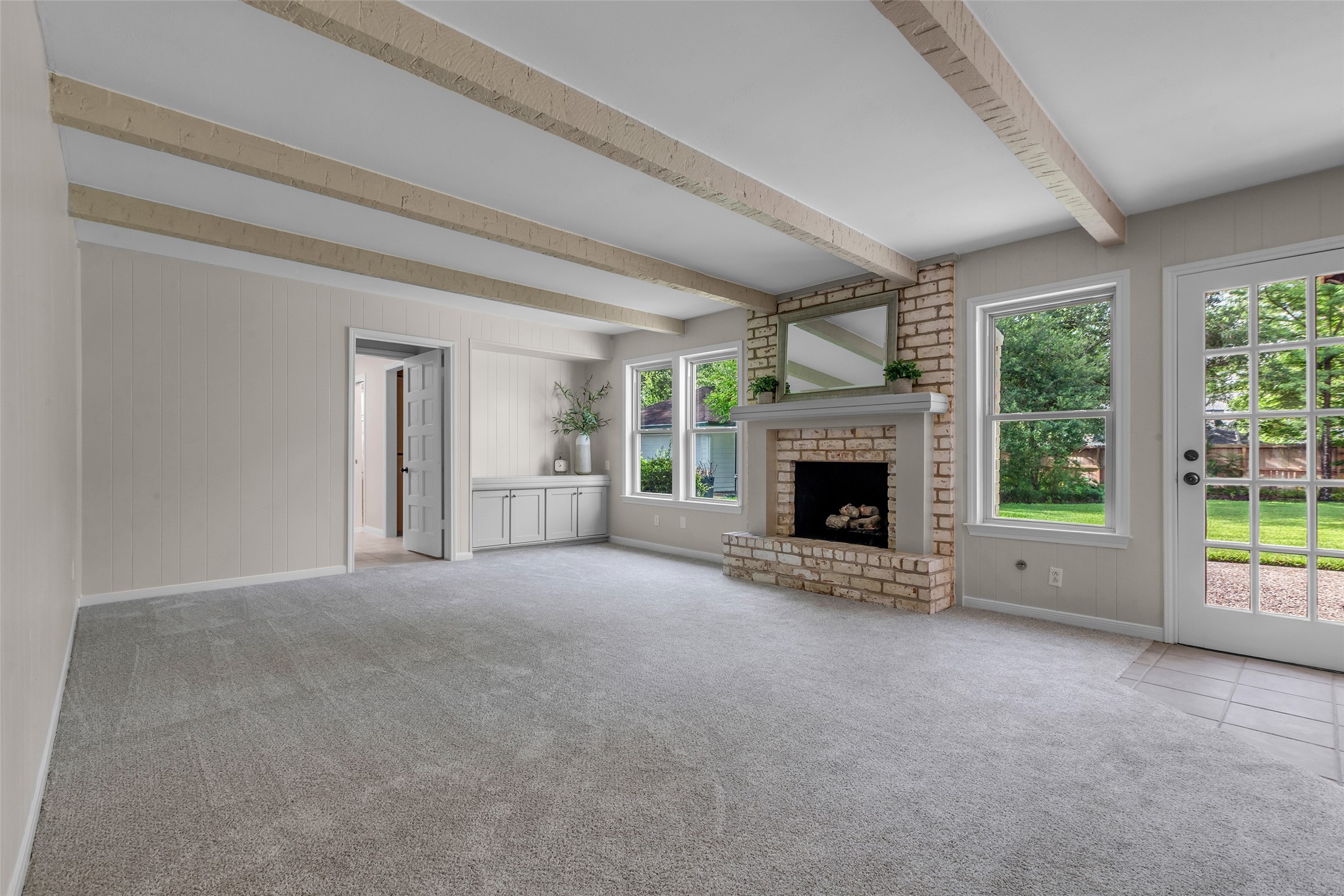 6415 Bayonne Drive Spring, TX 77389 - Photo 15 of 40 a view of an empty room with a fireplace and a window