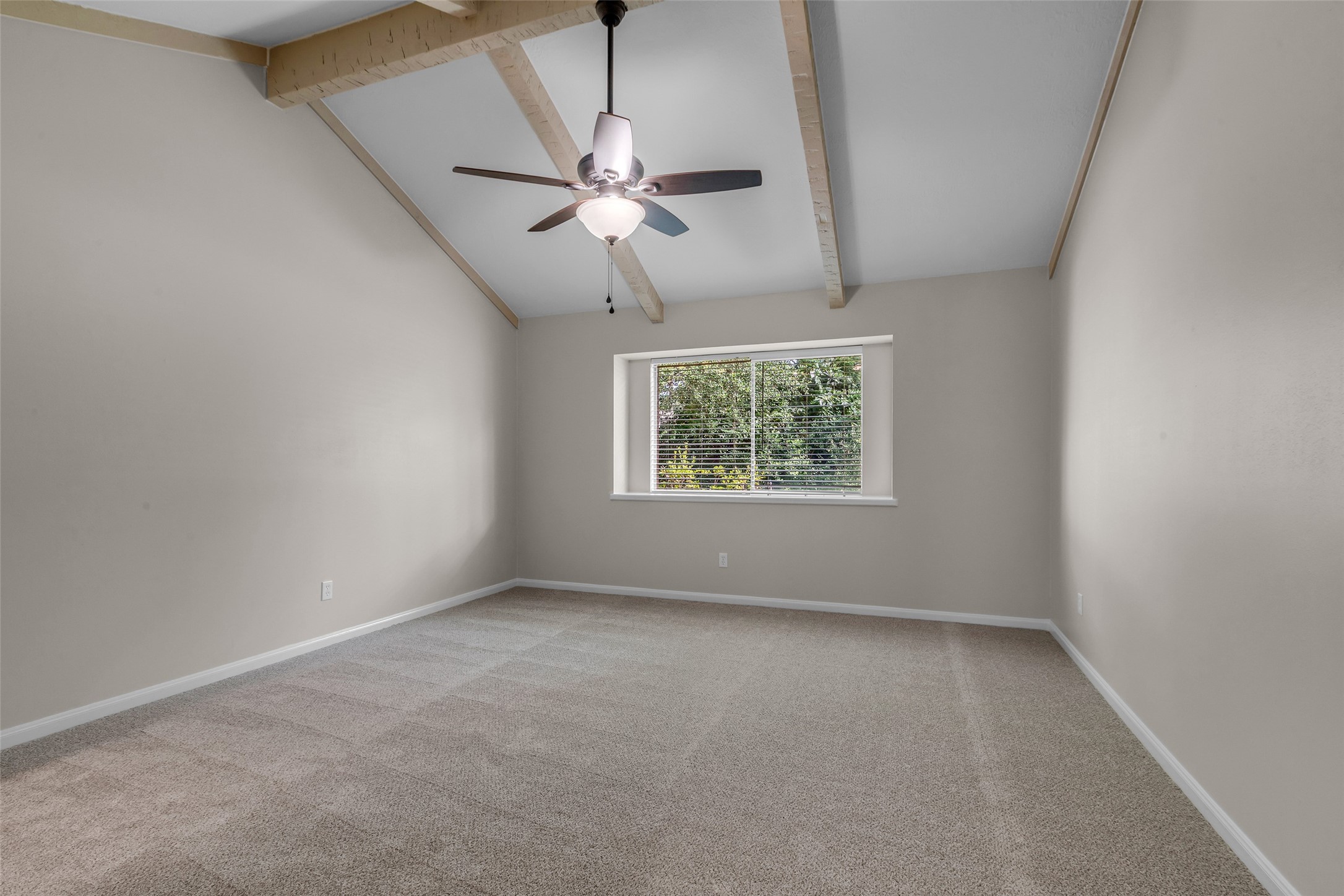 6415 Bayonne Drive Spring, TX 77389 - Photo 25 of 40 an empty room with a window and a fan