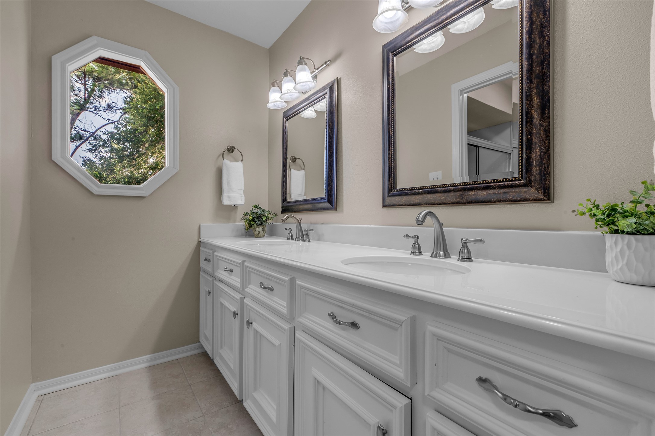6415 Bayonne Drive Spring, TX 77389 - Photo 31 of 40 a bathroom with a double vanity sink and a mirror