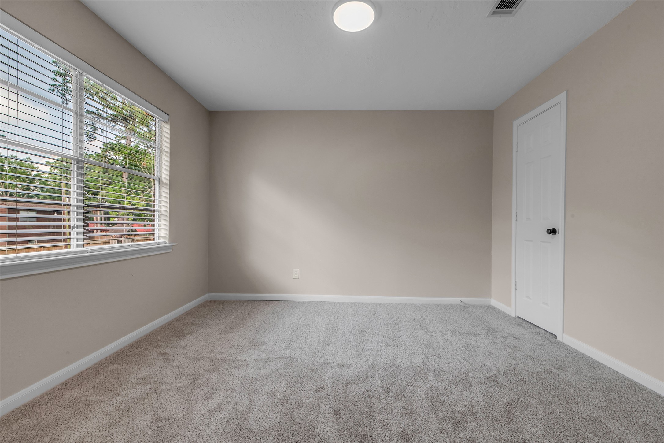 6415 Bayonne Drive Spring, TX 77389 - Photo 34 of 40 a view of an empty room with a window
