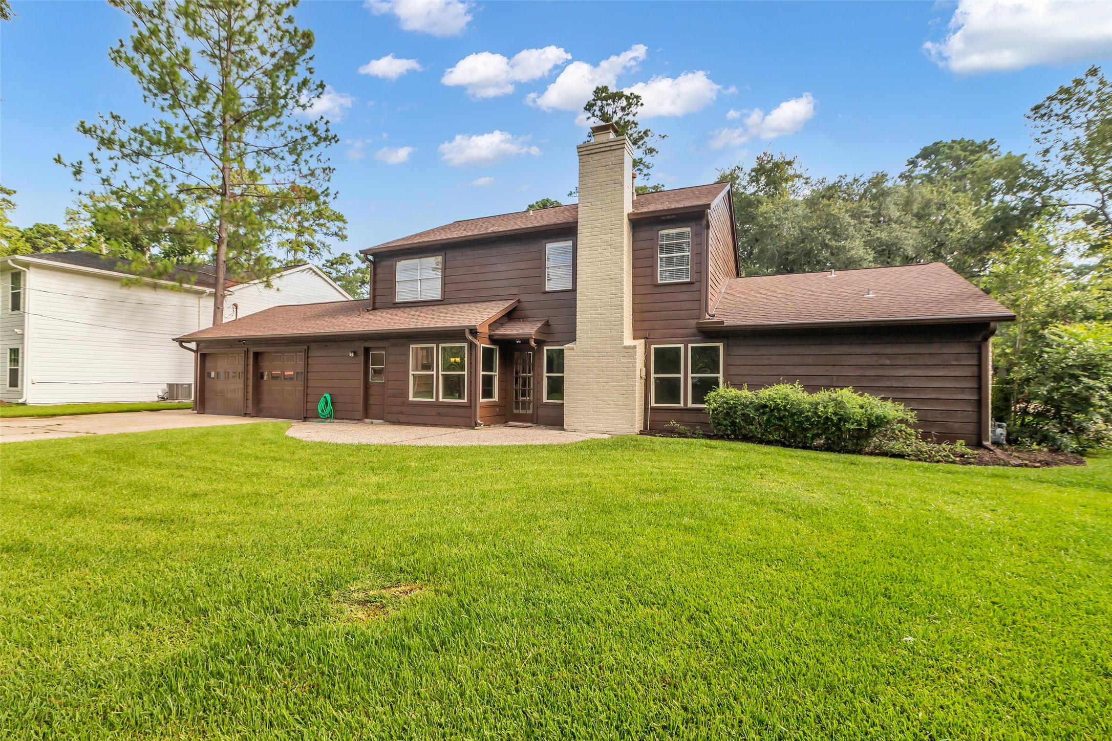 6415 Bayonne Drive Spring, TX 77389 - Photo 37 of 40 a front view of a house with a garden