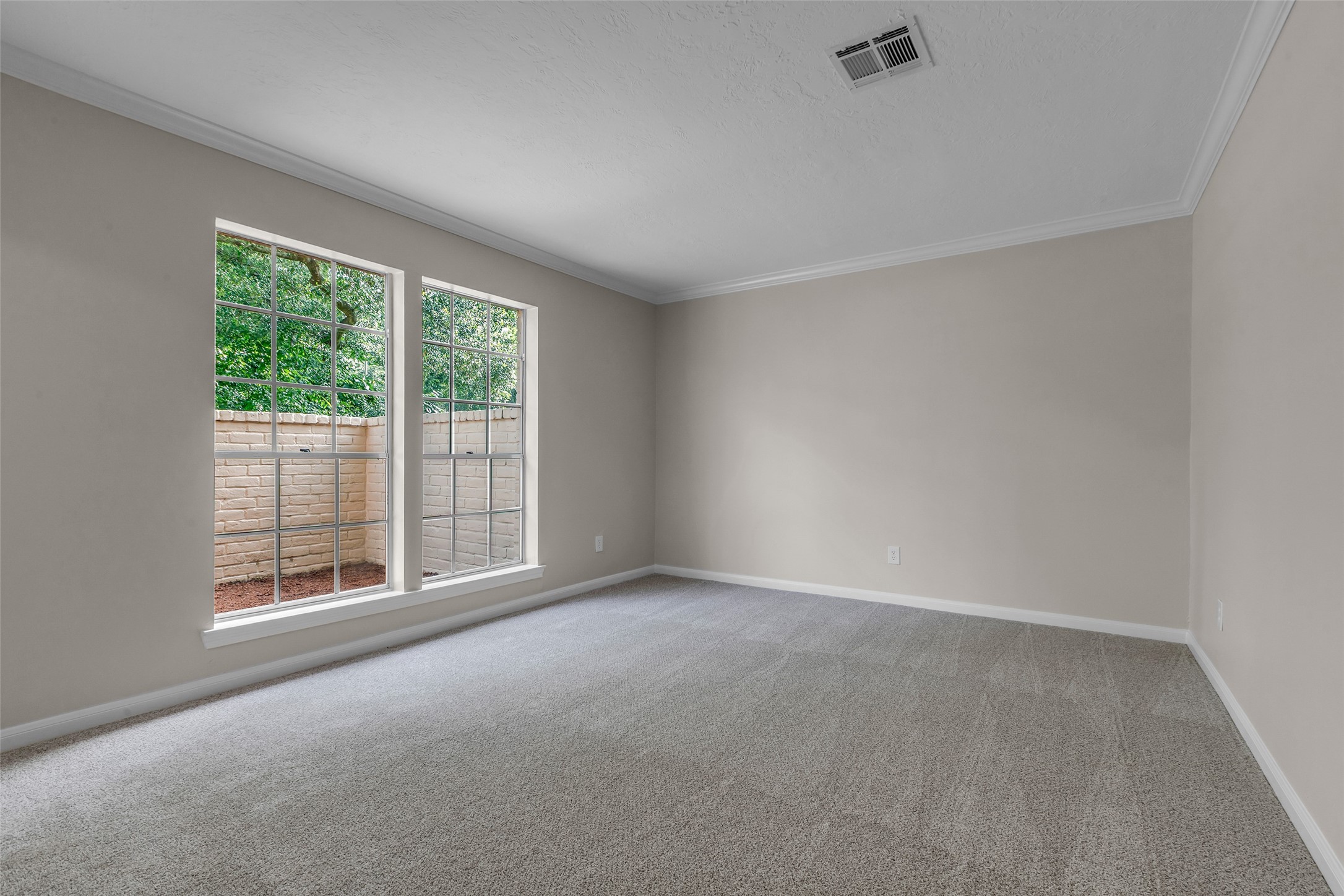 6415 Bayonne Drive Spring, TX 77389 - Photo 8 of 40 an empty room with wooden floor and windows