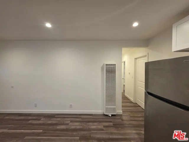 a view of a livingroom with wooden floor