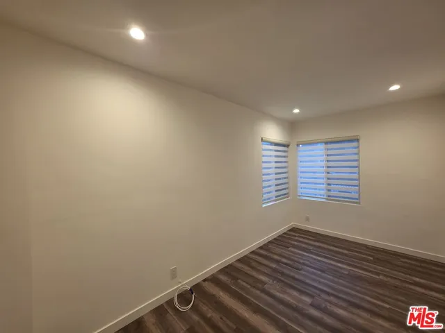 a view of a hallway with the wooden floor