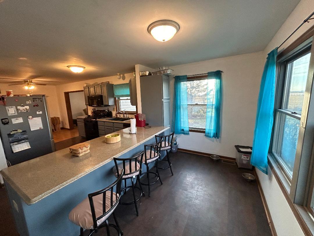 10598 North 3500W Road Manteno, IL 60950 - Photo 14 of 56 a kitchen with sink refrigerator and window