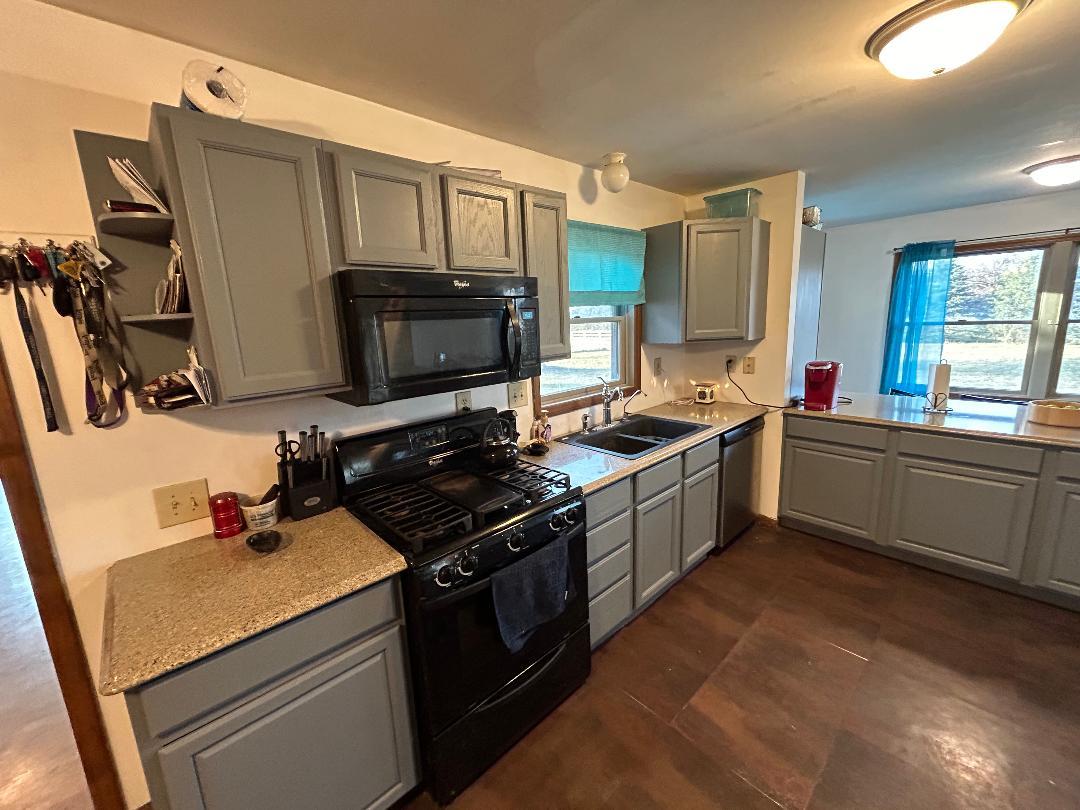 10598 North 3500W Road Manteno, IL 60950 - Photo 15 of 56 a kitchen with stainless steel appliances a sink stove and microwave