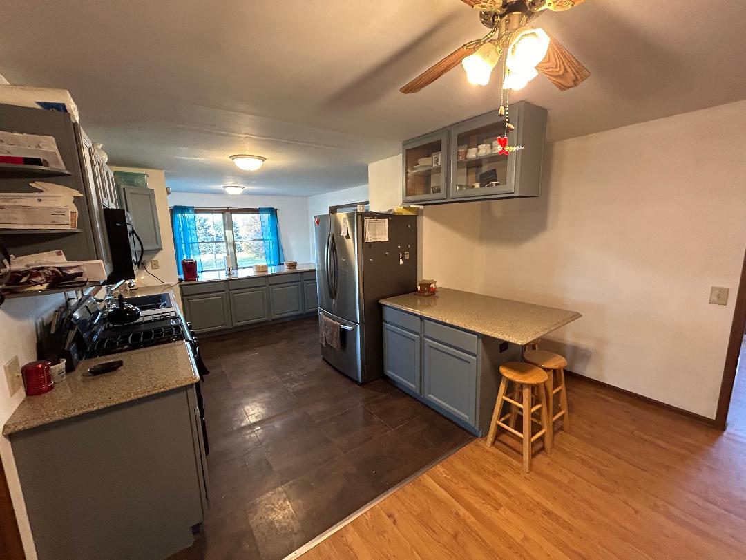 10598 North 3500W Road Manteno, IL 60950 - Photo 17 of 56 a room with furniture a flat screen tv and a window