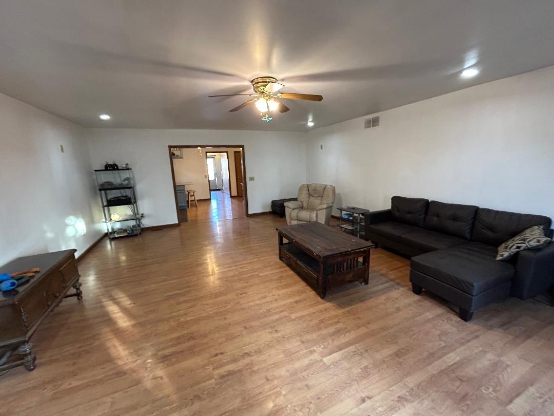 10598 North 3500W Road Manteno, IL 60950 - Photo 18 of 56 a living room with furniture and a wooden floor