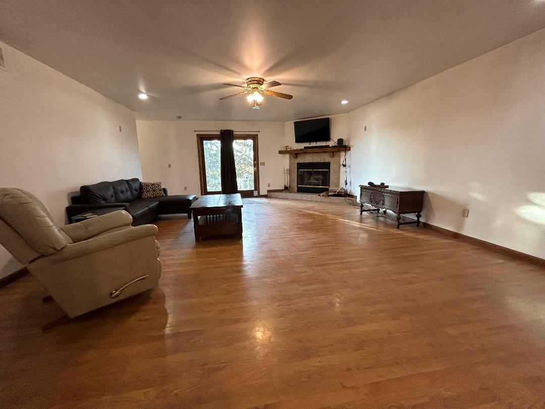 10598 North 3500W Road Manteno, IL 60950 - Photo 19 of 56 a living room with furniture and a flat screen tv