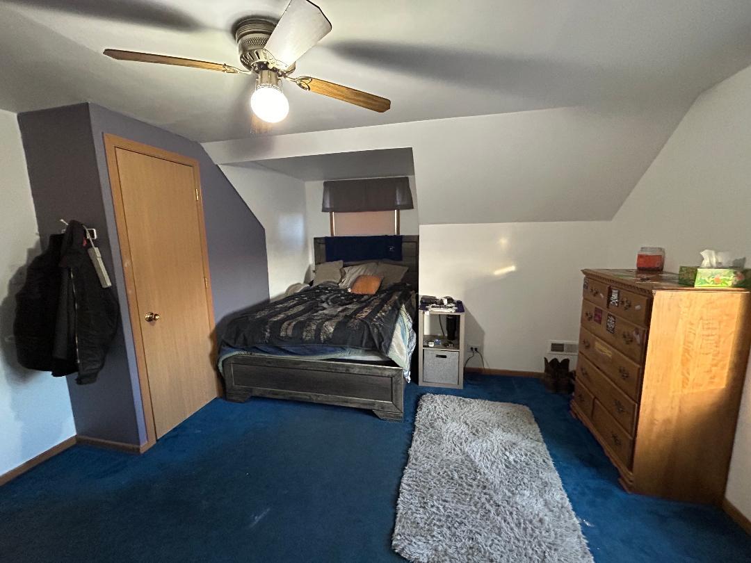 10598 North 3500W Road Manteno, IL 60950 - Photo 32 of 56 a living room with furniture and a fireplace