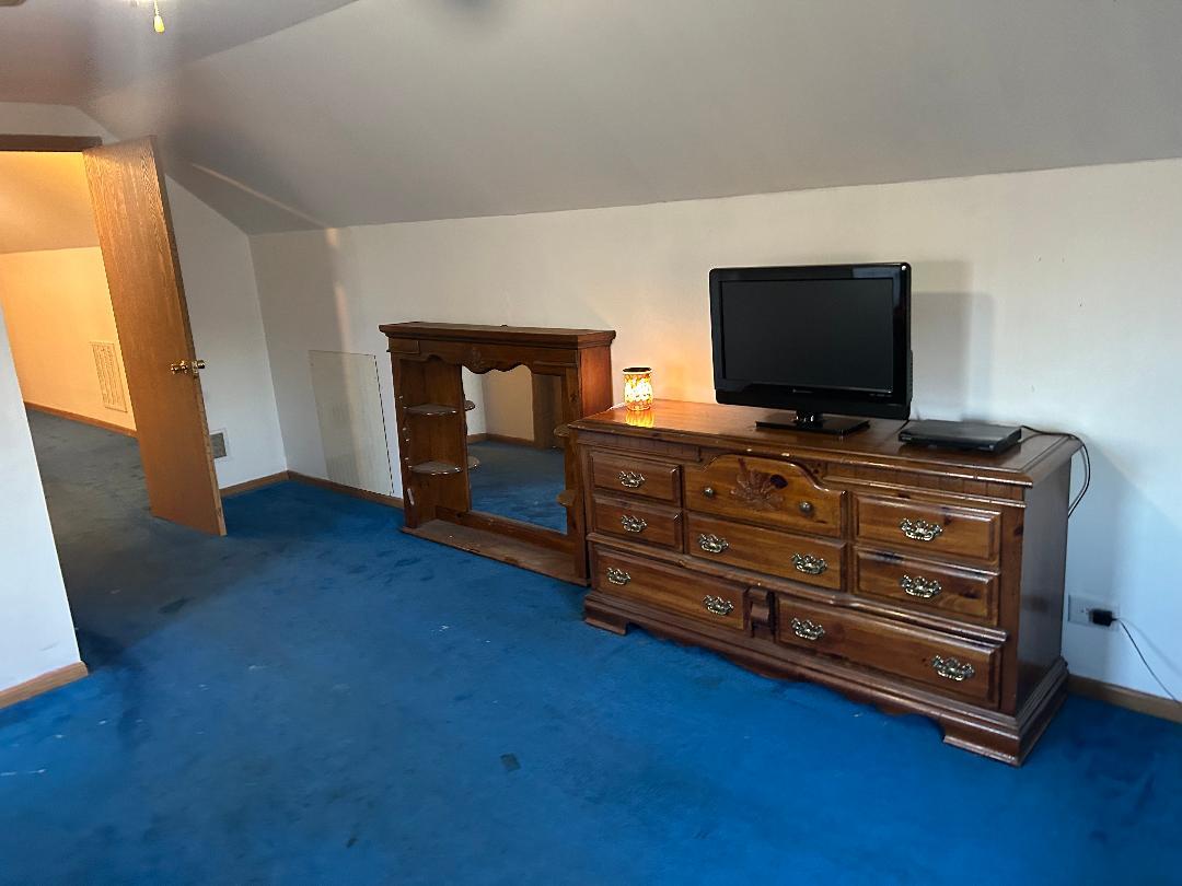 10598 North 3500W Road Manteno, IL 60950 - Photo 35 of 56 a living room with furniture and flat screen tv