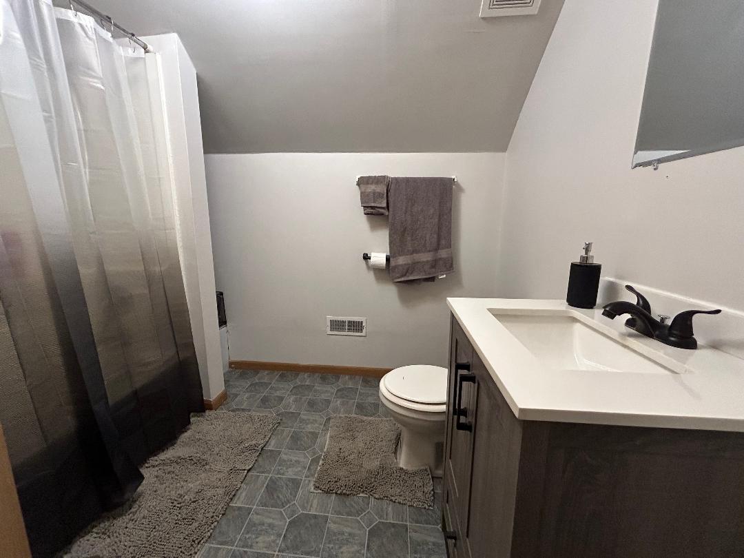 10598 North 3500W Road Manteno, IL 60950 - Photo 36 of 56 a bathroom with a sink toilet and vanity