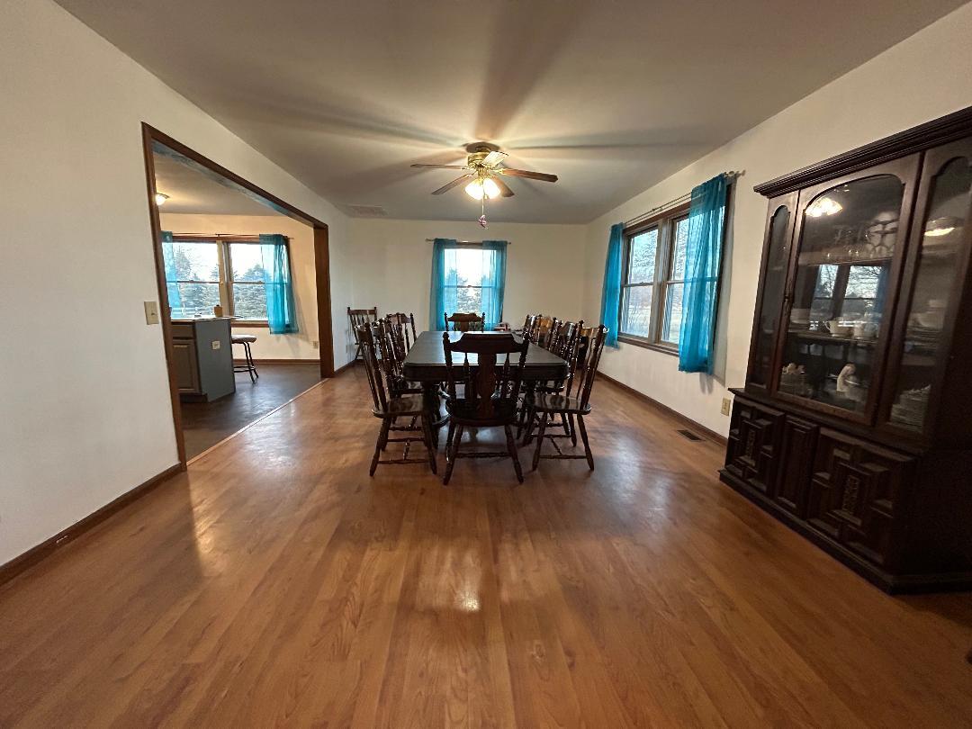 10598 North 3500W Road Manteno, IL 60950 - Photo 6 of 56 a view of a dining room with furniture window and wooden floor