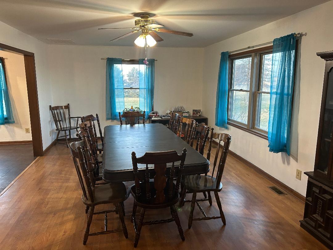 10598 North 3500W Road Manteno, IL 60950 - Photo 7 of 56 a view of a dining room with furniture window and wooden floor