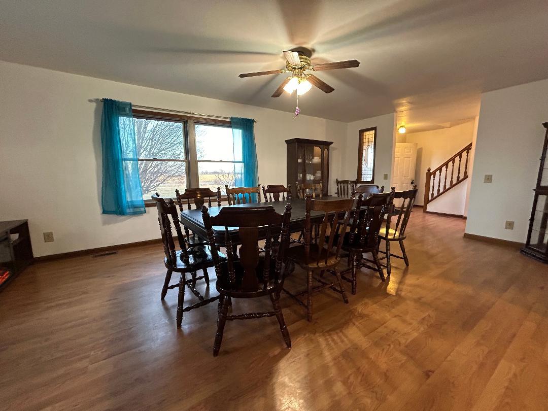 10598 North 3500W Road Manteno, IL 60950 - Photo 8 of 56 a view of a dining room with furniture window and wooden floor