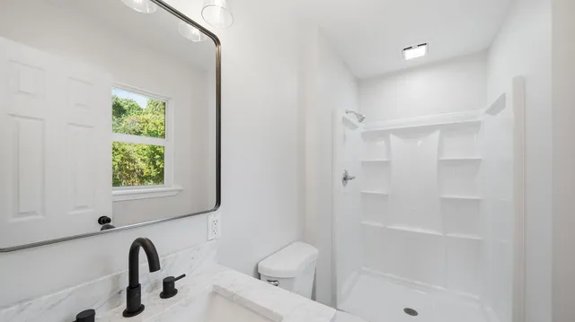 a bathroom with a toilet a sink and a bathtub