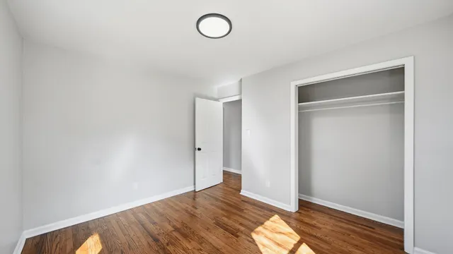 a view of room with wooden floor
