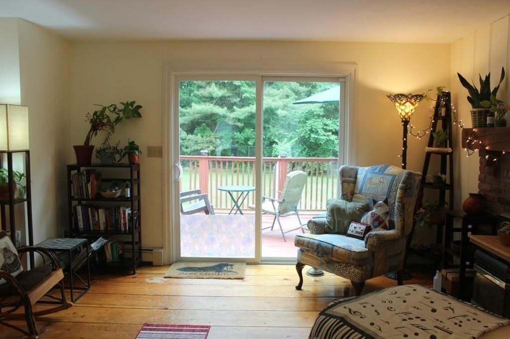 63 Grove Street Upton, MA 01568 - Photo 12 of 42 a living room with furniture and a floor to ceiling window