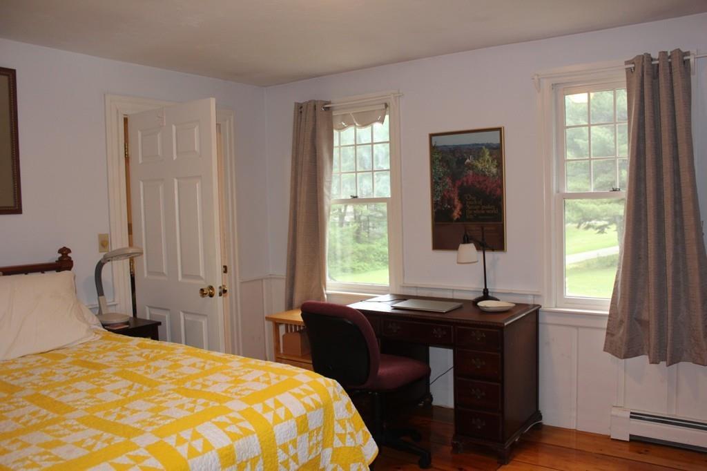 63 Grove Street Upton, MA 01568 - Photo 17 of 42 a bedroom with a bed and a window