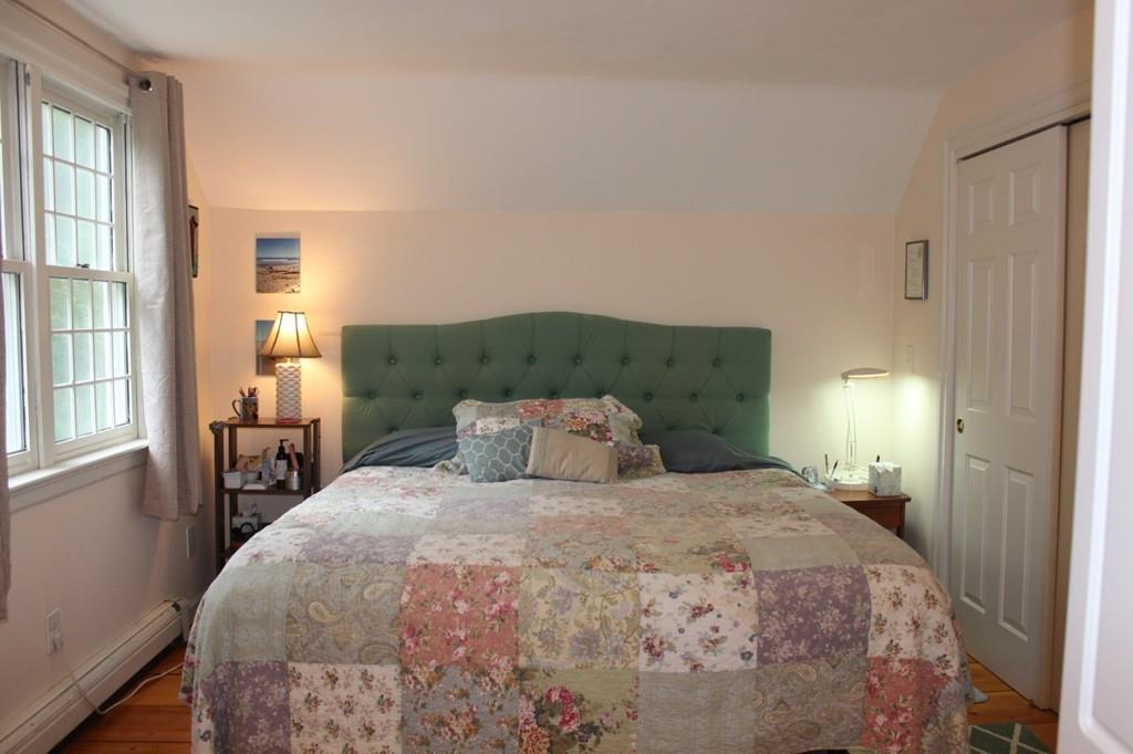 63 Grove Street Upton, MA 01568 - Photo 19 of 42 a bedroom with a large bed and a window