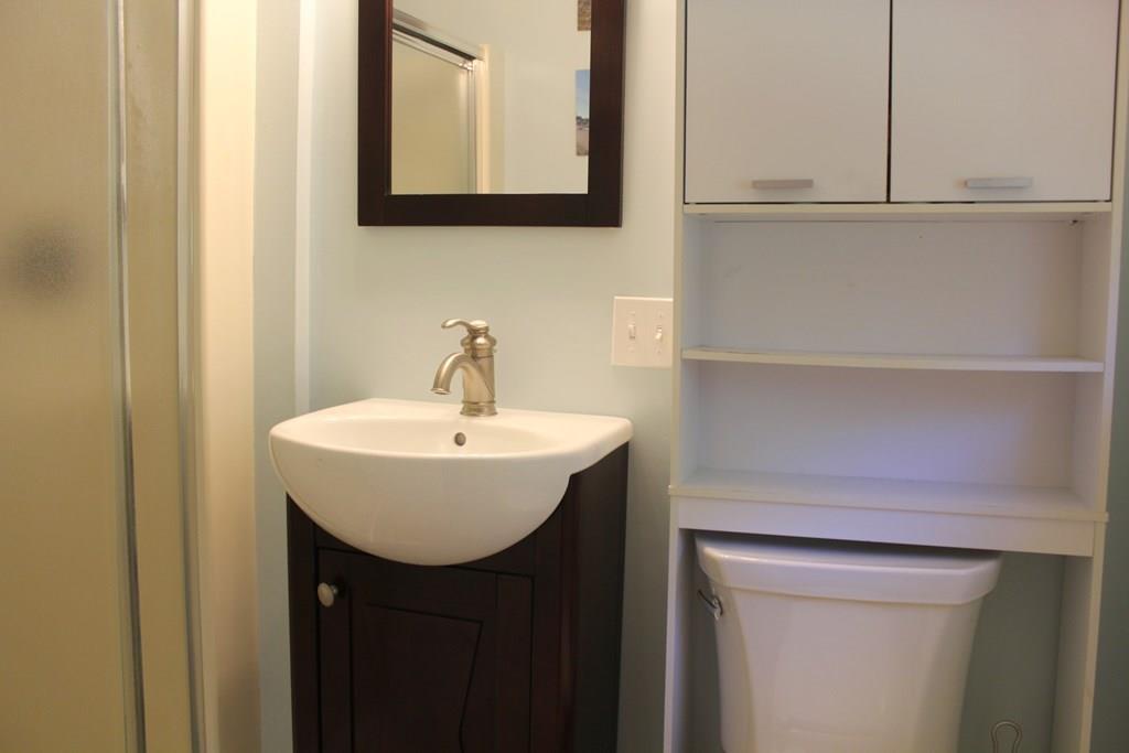 63 Grove Street Upton, MA 01568 - Photo 21 of 42 a bathroom with a sink and a mirror
