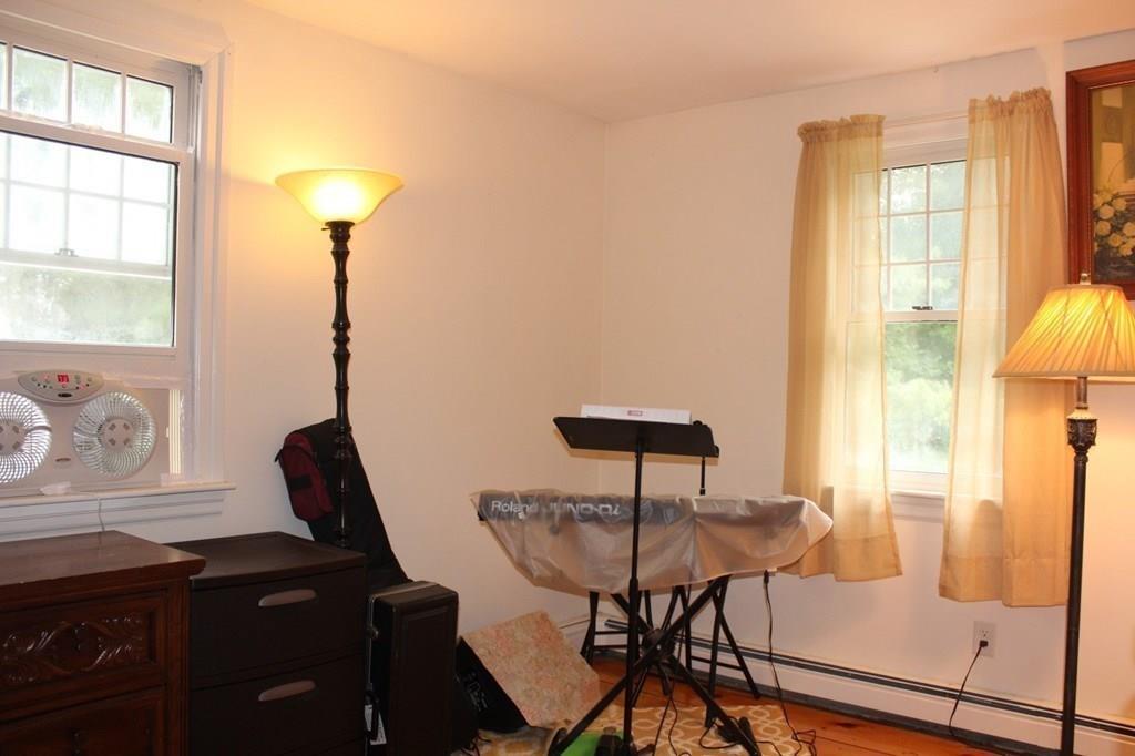 63 Grove Street Upton, MA 01568 - Photo 22 of 42 a view of a workspace room with furniture and a window