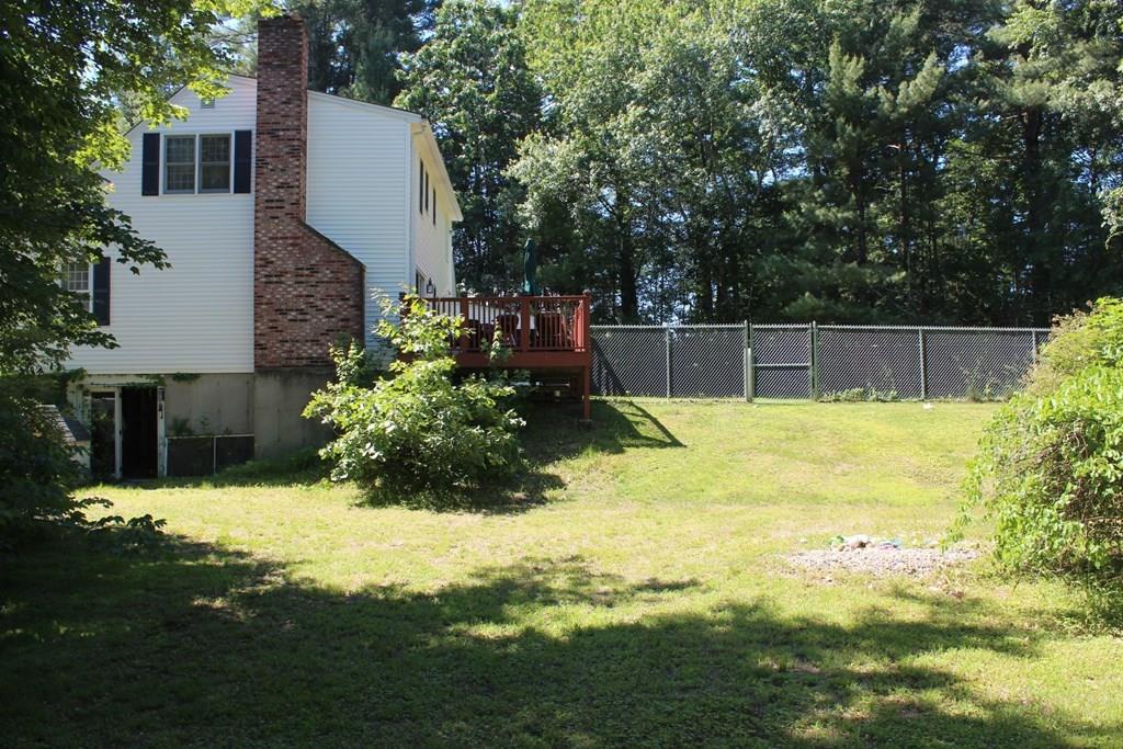 63 Grove Street Upton, MA 01568 - Photo 32 of 42 a view of a backyard with swimming pool