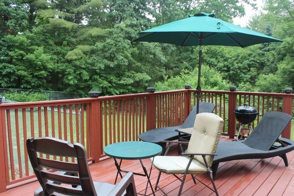 63 Grove Street Upton, MA 01568 - Photo 37 of 42 a view of a chair and table on the deck