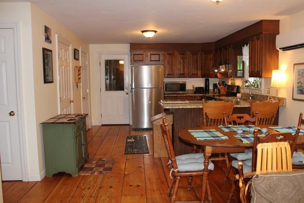 63 Grove Street Upton, MA 01568 - Photo 5 of 42 a kitchen with stainless steel appliances granite countertop a refrigerator and a stove top oven