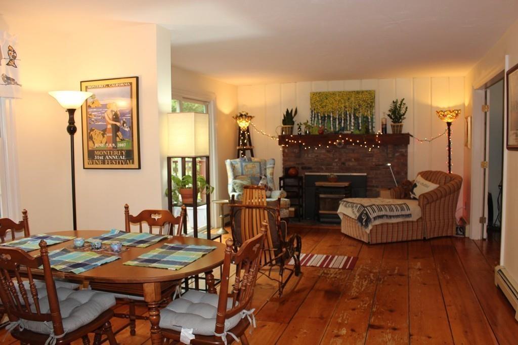 63 Grove Street Upton, MA 01568 - Photo 9 of 42 a living room with furniture and a fireplace