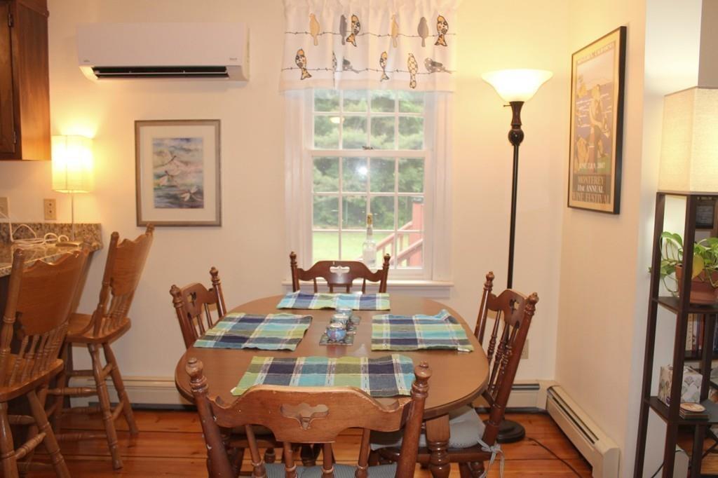 63 Grove Street Upton, MA 01568 - Photo 10 of 42 a view of a dining room with furniture window and wooden floor