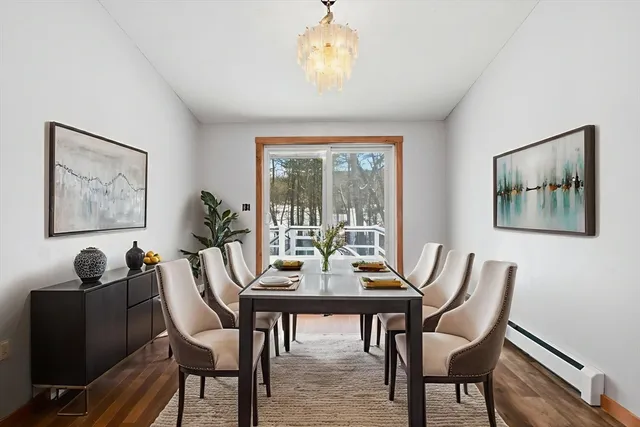 a dining room with furniture and window