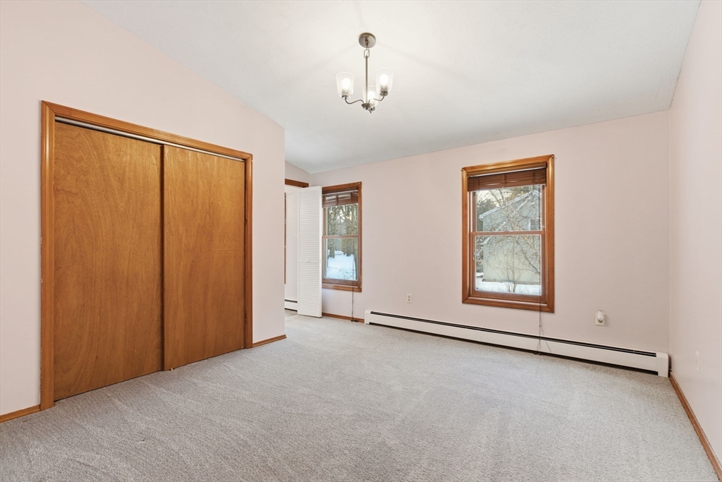 235 Crouch Road Warren, MA 01092 - Photo 22 of 42 an empty room with windows and closet