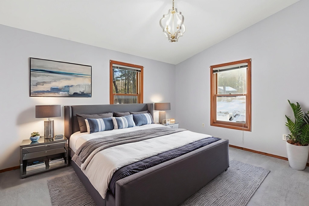 235 Crouch Road Warren, MA 01092 - Photo 30 of 42 a spacious bedroom with a bed and a window