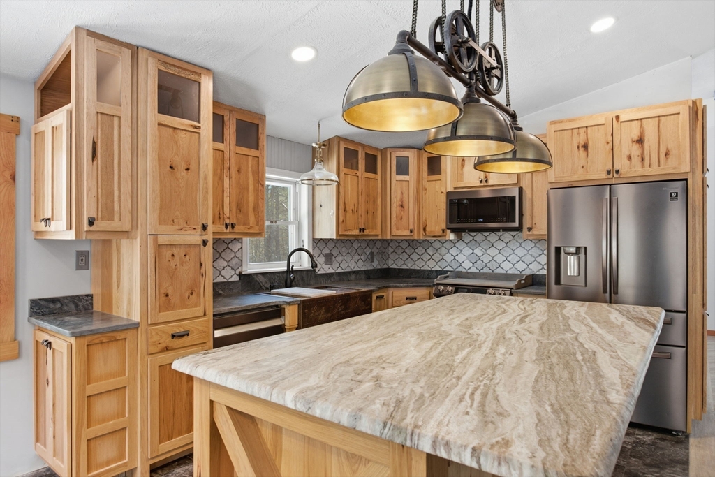 235 Crouch Road Warren, MA 01092 - Photo 5 of 42 a kitchen with stainless steel appliances a sink stove and refrigerator