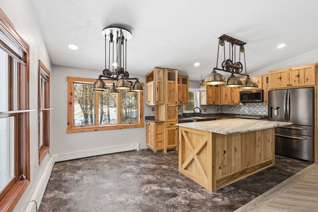 235 Crouch Road Warren, MA 01092 - Photo 8 of 42 a kitchen with stainless steel appliances granite countertop a stove oven and a refrigerator