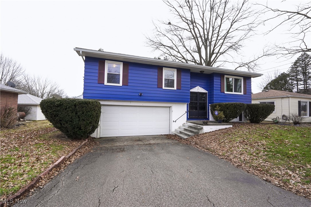 2674 Smith Road Fairlawn, OH 44333 - Photo 2 of 31 Split foyer home featuring aphalt driveway and an attached garage